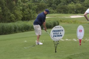tmba golf tournament 2016 1 man preparing golf shot