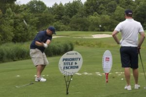 tmba golf tournament 2016 1 man swinging 1 man waiting at tee