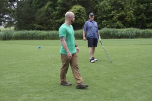 tmba golf tournament 2016 staff and player laughing on course