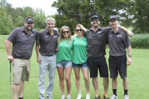 tmba golf tournament 2016 OVM financial team with 2 priority title staff on green