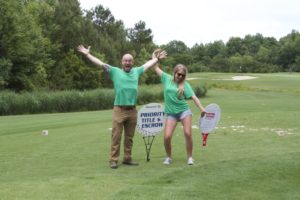 tmba golf tournament 2016 2 priority staff members laughing on green v2