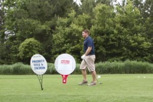 tmba golf tournament 2016 man walking away from tee