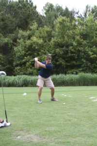 tmba golf tournament 2016 man swinging club from tee backswing