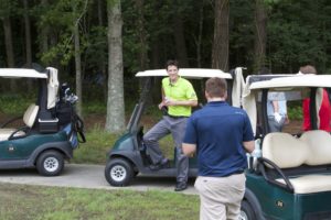 tmba golf tournament 2016 man getting out of golfcart